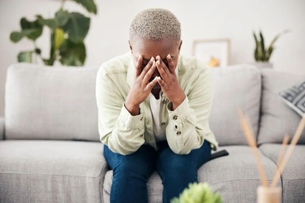 Older woman feeling overwhelmed while considering support after noticing changes in mood and daily functioning