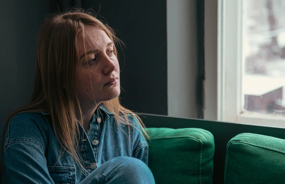 Woman experiencing persistent low mood while trying to manage the pressures of everyday life in London