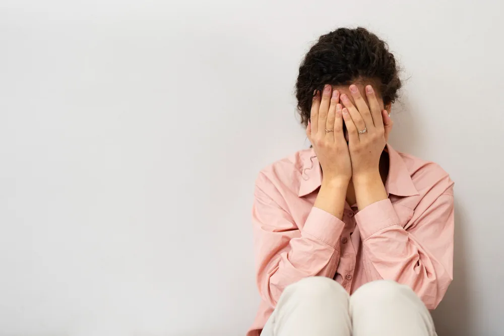 Woman showing intense emotional distress while struggling to cope with overwhelming depressive feelings